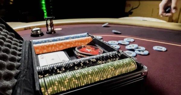 Burgundy casino table. High contrast image of casino roulette and poker chips