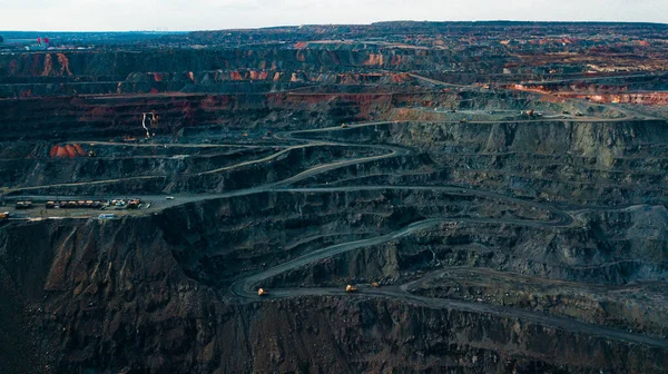 Aerial view of the Iron ore mining, Panorama of an open-cast mine extracting iron ore, preparing for blasting in a quarry mining iron ore, Explosive works on open pit