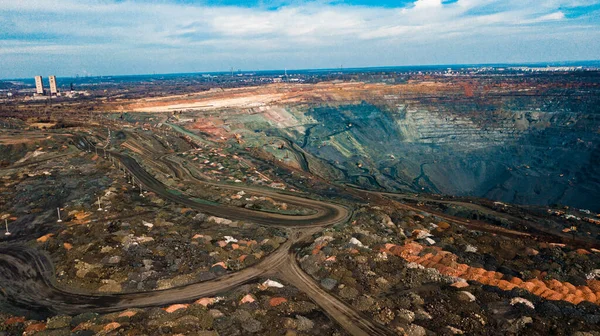 Aerial view of the Iron ore mining, Panorama of an open-cast mine extracting iron ore, preparing for blasting in a quarry mining iron ore, Explosive works on open pit