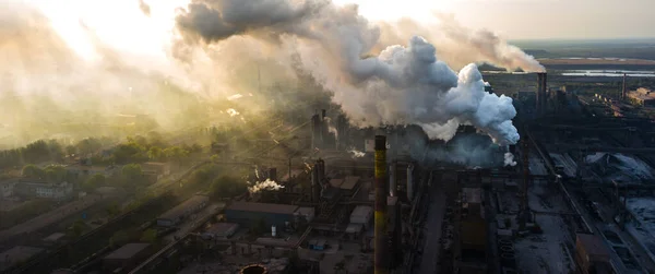 industry metallurgical plant dawn smoke smog emissions bad ecology aerial photography