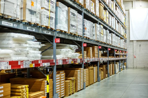 Warehouse, storage room in a large store. Laid out the goods on the shelves