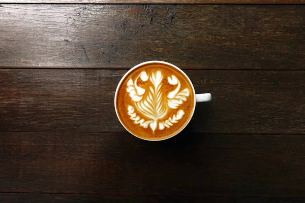 Cup of latte art coffee — Stock Photo, Image