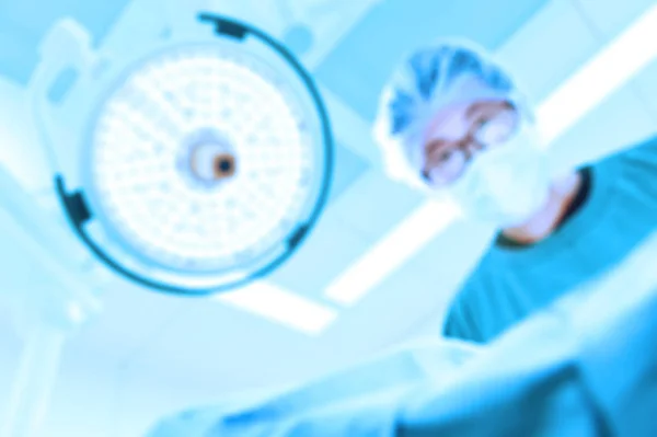 Blur of  veterinarian surgeons in operating room — Stock Photo, Image