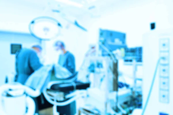 Blur of two veterinarian surgeons in operating room — Stock Photo, Image