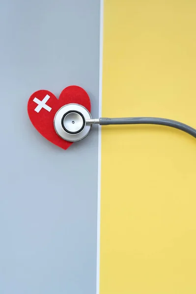 Red heart and stethoscope for background