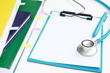 arka plan için defter ile stetoskop, yakın çekim