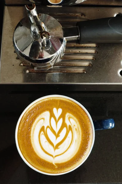 close up of coffee machine preparing cup of coffee