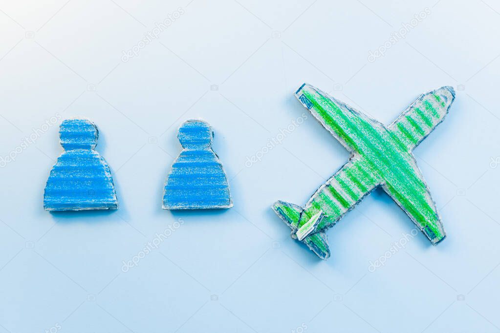 blue background, paper toys and green plane 