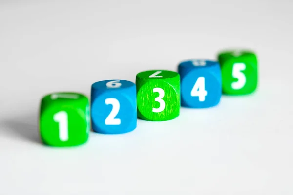 toy cubes with numbers on white background