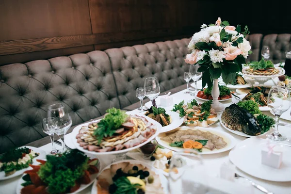 table full of meal served for wedding celebration