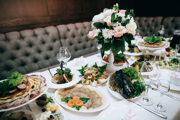 table full of meal served for wedding celebration