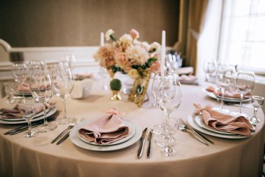 elegant table setting for a wedding banquet, pastel beige decorations