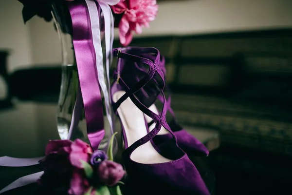 Purple wedding. Purple bouquet and bride shoes. Wedding morning, accessories