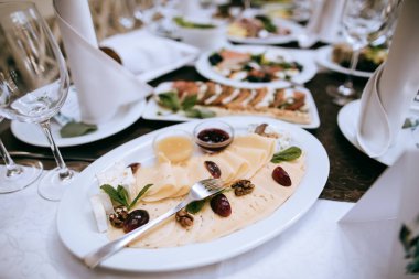 Food on the table for dinner at a restaurant at a wedding party.  Catering 