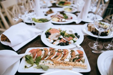 Food on the table for dinner at a restaurant at a wedding party. Table set
