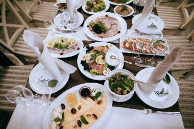 Food on the table for dinner at a restaurant at a wedding party. Table set