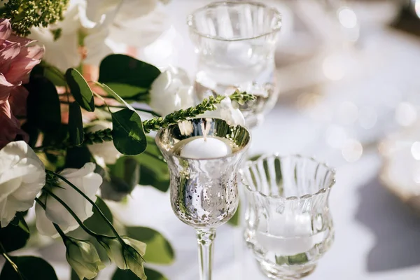 elegant table set, Table decoration at the wedding ceremony in the summer garden with candlesticks