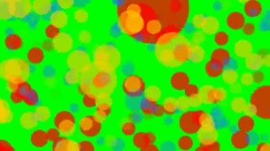 Yarı saydam yeşil ekran üzerinde uçan daireler kullanılan renkler. Çok renkli parçacıklar arka plan üzerinde düzensiz hareket.
