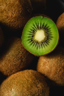 Kiwi fruit half sliced close up macro, healthy lifestyle and food, vibrant green color