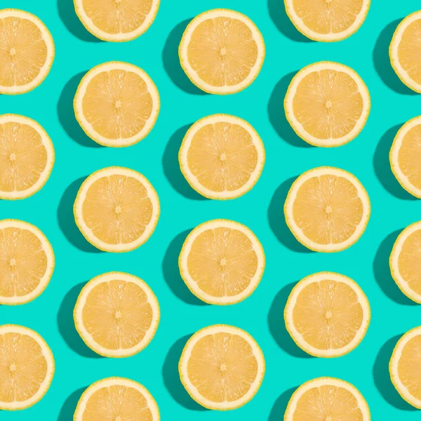 Lemon citrus fruits seamless pattern on green turquoise minimal background, tropical fresh juicy slices