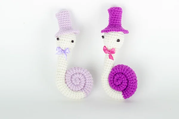 Soft toy crochet in the form of a snail in a cap — Stock Photo, Image