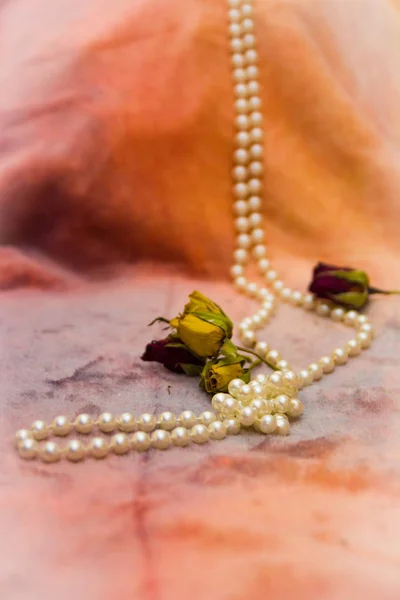 roses buds and pearl beads