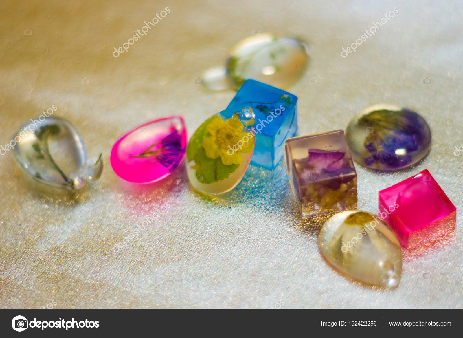Crystals made of epoxy resin with glitters and flowers ⬇ Stock Photo