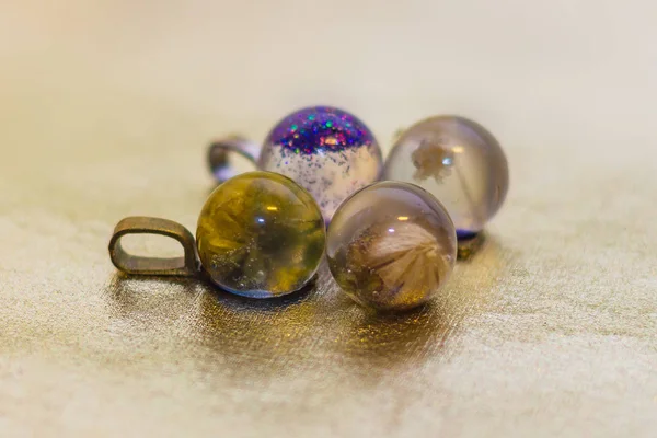 Four crystals made of epoxy resin close-up — Stock Photo, Image