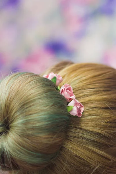 Girl with topknot with hairpins