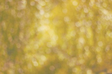 Bokeh tonlu ima ile deffocused sarı arka plan yapılmış doku