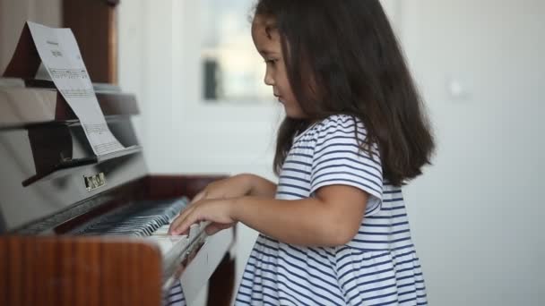 Kazakh Asian Little Girl Learning Play Piano — Stock Video