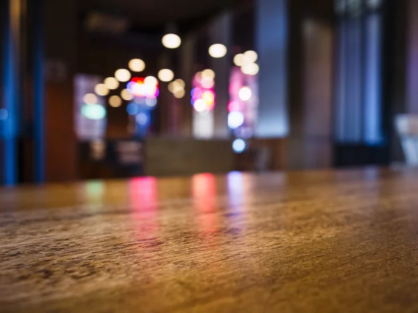 Table top Bar counter desk Blurred colourful lighting background — Stock Photo, Image