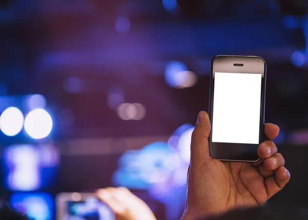 Mano celebración del teléfono celular Pantalla en blanco Foto disparo Iluminación desenfoque Fondo —  Fotos de Stock