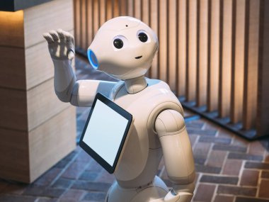 KYOTO, JAPAN - APR 14, 2017 : Pepper Robot Assistant with Information screen clipart