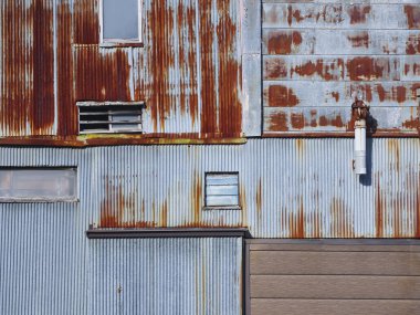 Demir duvar paslanmış metal duvar Eski bina Grunge dokusu