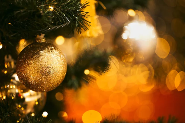 Fir branch with balls and festive lights — Stock Photo, Image