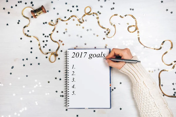 Holiday decorations and notebook with 2017 goals