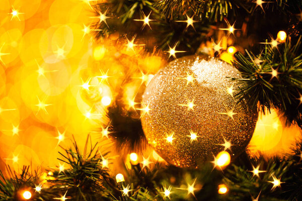 Fir branch with balls and festive lights