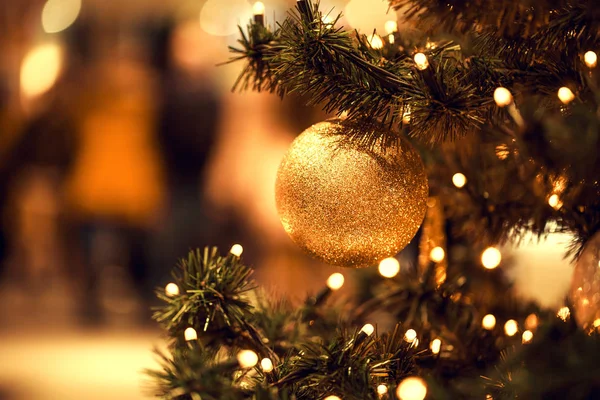 Fir branch with balls and festive lights — Stock Photo, Image