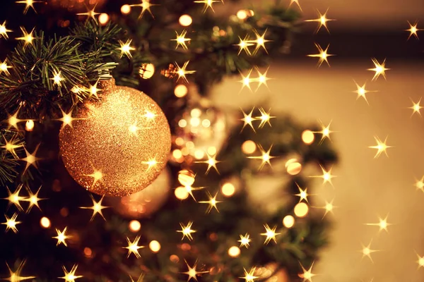 Fir branch with balls and festive lights — Stock Photo, Image