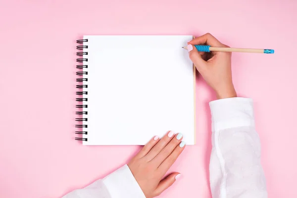 Woman holding pencil a — Stock Photo, Image