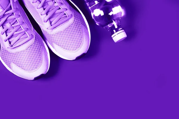 Ultra Violet sneakers and bottle — Stock Photo, Image