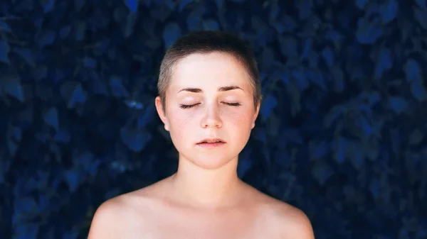 Portrait of authentic woman over blue plant — Stock Photo, Image