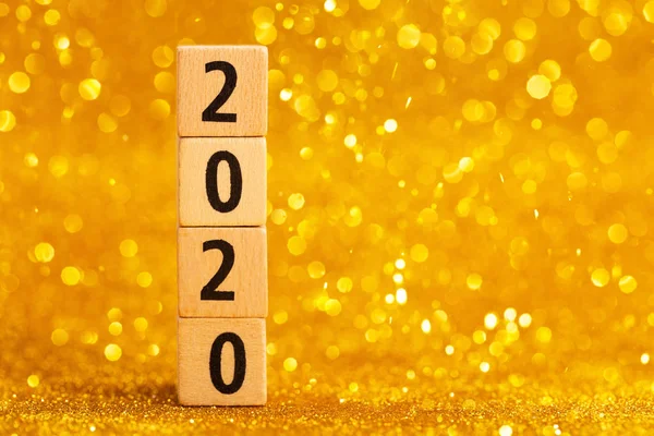 Horisontal numbers of 2020 on golden sparkling background. — Stock Photo, Image