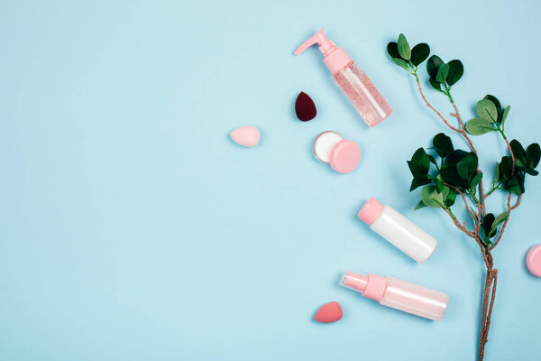 Care cosmetics on green background