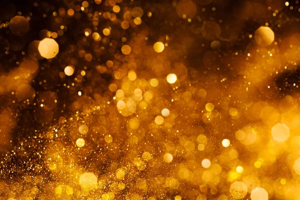 Splash of golden sparkles — Stock Photo, Image