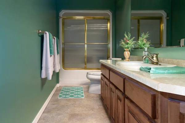 Home guest bathroom that has been remodeled with luxury vinyl tile flooring.