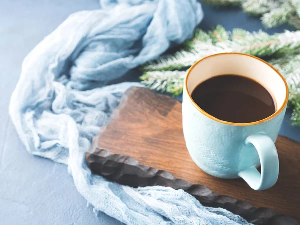 Mug of coffee and milk on dark winter background