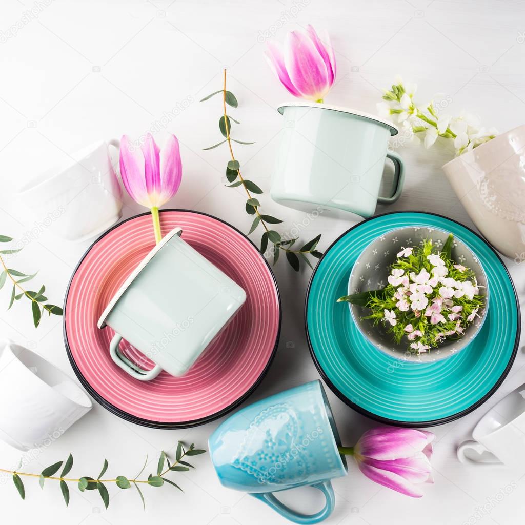Spring crockery concept with tulips flowers pastel color