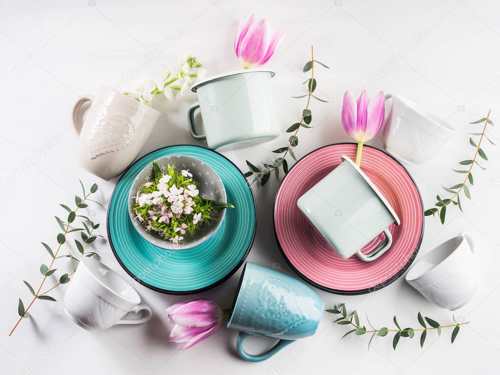 Spring crockery concept with tulips flowers pastel color
